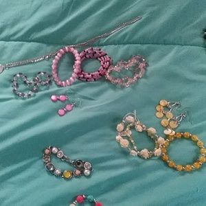 Sets ear rings, necklaces and bracelets